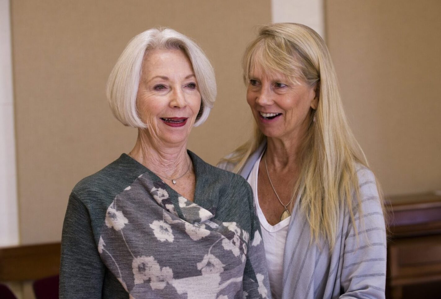 Two women smiling for a picture together.