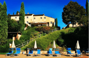 A group of chairs and umbrellas on the beach.