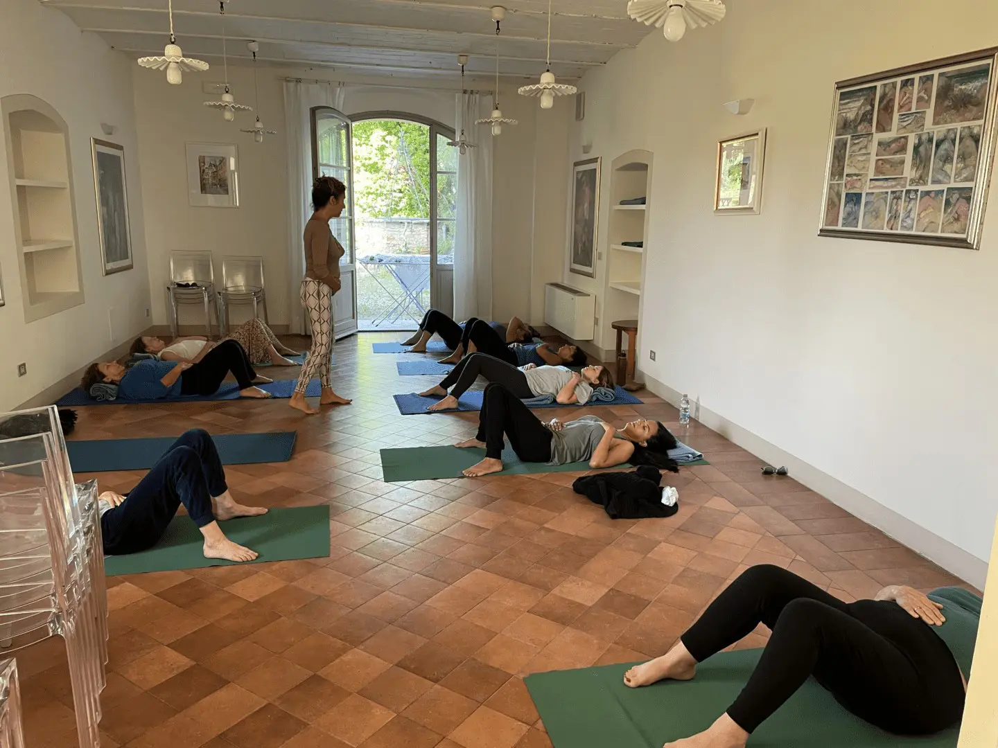 A group of people doing yoga in a room.